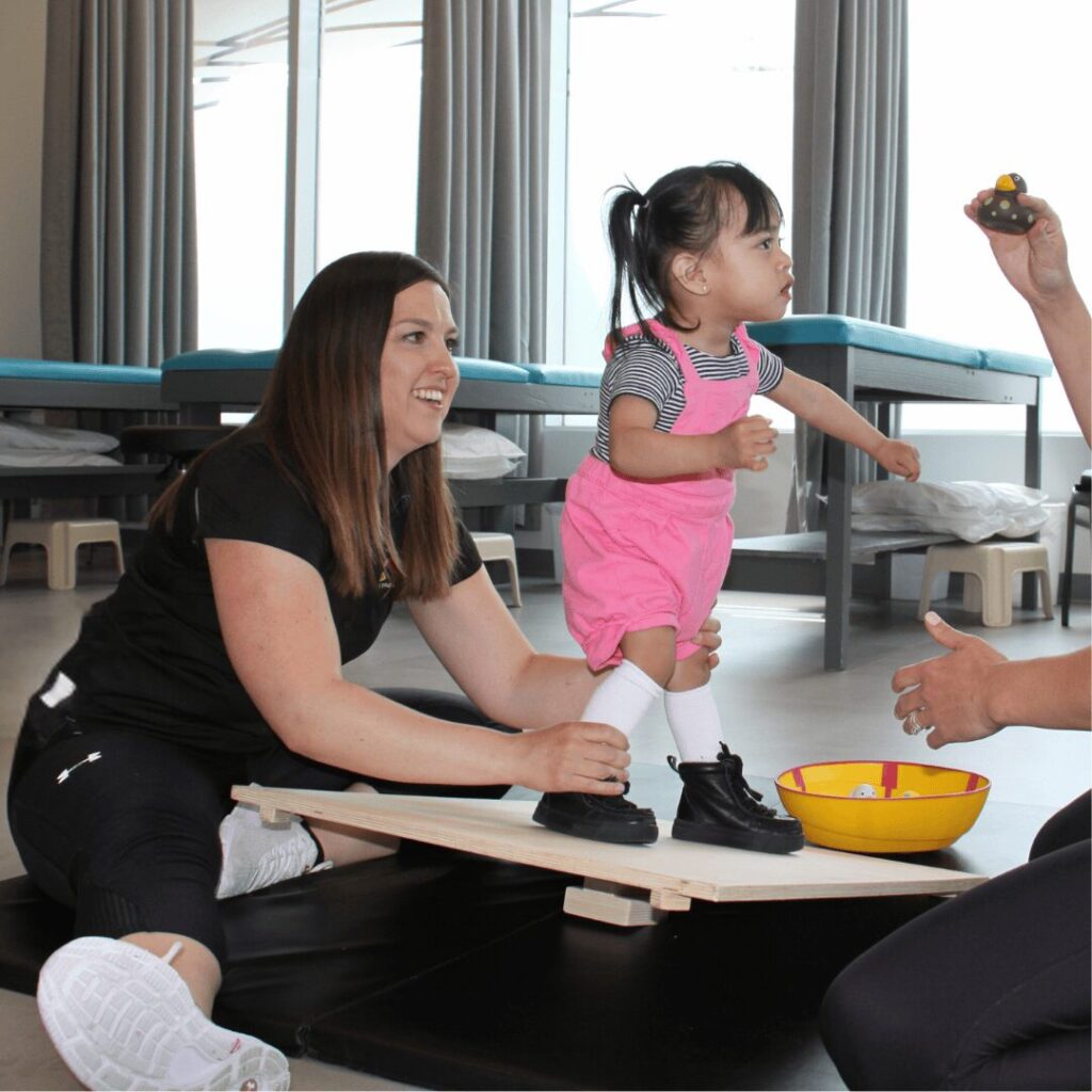 physiotherapist and young girl do CME therapy